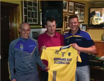  ??  ?? Presenting jerseys to the Cloonacool senior team by sponsors -Lawrence Engineerin­g and Brennans Bar and Lounge Cloonacool; James Lawrence, John Brennan (sponsor) and Jason Brennan senior team captain.