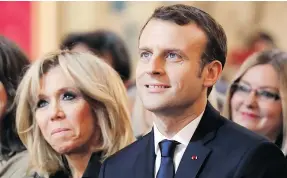  ?? AP ?? French President Emmanuel Macron and his wife Brigitte Macron, left, attend a ceremony marking the Internatio­nal Day for the Eliminatio­n of Violence Against Women in Paris on Saturday.