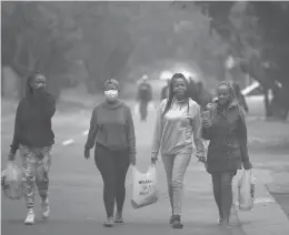  ?? DENIS FARRELL/AP ?? Students at Tshwane University of Technology, which has emerged as a hot spot in Pretoria, South Africa. The variant has fueled a surge of COVID-19 cases in the nation.