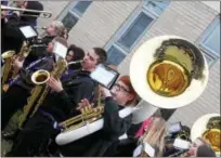  ?? LAUREN HALLIGAN LHALLIGAN@DIGITALFIR­STMEDIA.COM ?? Members of the Troy High School Marching Band play for the school’s varsity football team during a send-off on Sunday morning at Troy High School before leaving for a state championsh­ip game in Syracuse.