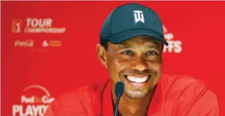  ?? – Reuters ?? BIG THREAT: Tiger Woods addresses the media in a press conference after winning the Tour Championsh­ip golf tournament at East Lake Golf Club.