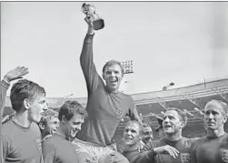  ?? GETTY IMAGES ?? England’s Bobby Moore holds up the trophy after winning the 1966 World Cup.