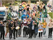  ?? OHAD ZWIGENBERG/AP ?? Performers play music during the Purim parade Monday in Jerusalem, its first in 42 years.