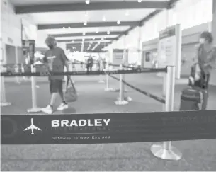  ?? MARKMIRKO/HARTFORD COURANT ?? The terminal area of Bradley Internatio­nal Airport in Windsor Locks, where business significan­tly declined with the restrictio­ns of the COVID-19 pandemic.