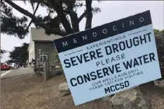  ?? Haven Daley/Associated Press ?? Signs alert visitors to the severe drought Aug. 4 in Mendocino, Calif.