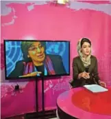  ??  ?? An Afghan presenter records her morning programme at the Zan TV (Women's TV) station in Kabul.