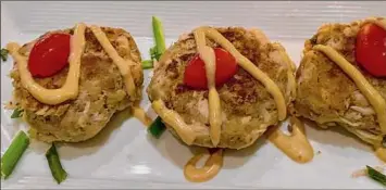  ?? ?? Spicy crab cakes lined up at Stella Pasta Bar & Bistro.