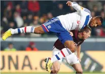  ?? PETR DAVID JOSEK/ASSOCIATED PRESS FILES ?? Olympique Lyon’s Harry Novillo dives over Manuel Pamic from Sparta Prague in a 2012 match.