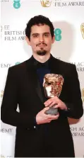  ??  ?? Director Damien Chazelle with his BAFTA award for Best Director for the film "La La Land'.