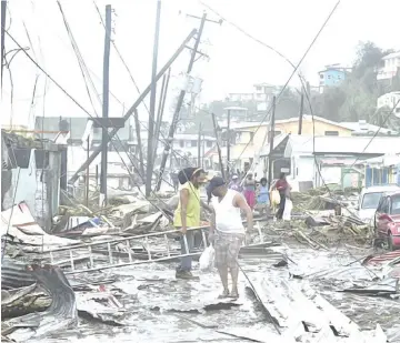  ?? — Wikimedia photo ?? Roseau, the capital of Dominica in the aftermath of the hurricane.