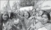  ?? AFP ?? BJP supporters celebrate the party’s victory, in New Delhi on Saturday.