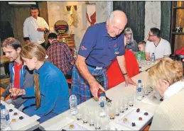  ??  ?? Campbell Laing pours whisky at one of the masterclas­ses.