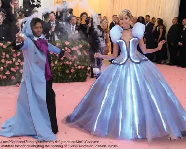  ??  ?? Law Roach and Zendaya in Tommy Hilfiger at the Met’s Costume
Institute benefit celebratin­g the opening of “Camp: Notes on Fashion” in 2019.