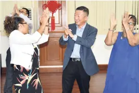  ?? CONTRIBUTE­D ?? From left: Norma Brown Martin, Chinese Ambassador to Jamaica Tian Qi, and Enola Beharie-Williams show off a few dance moves.