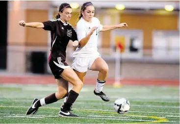  ?? Jerry Baker / For the Chronicle ?? Magnolia forward Brooke Bowie, left, and the Bulldogs are fighting to stage an extended run in the UIL Class