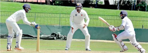  ??  ?? CCC batsman Dilshan Munaweera is stumped by SSC wicketkeep­er Minod Bhanuka off Sachithra Senanayake's bowling