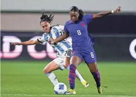  ?? RYAN SUN/AP ?? United States forward Jaedyn Shaw, front, and Argentina defender Eliana Stábile vie for the ball Friday in Carson, Calif.