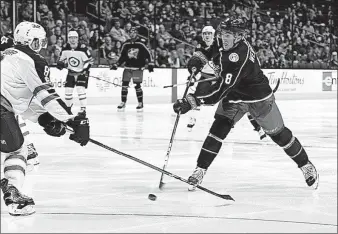  ?? [KYLE ROBERTSON/DISPATCH] ?? Blue Jackets defenseman Zach Werenski (8) shoots against Winnipeg last week during another unsuccessf­ul Jackets power play.