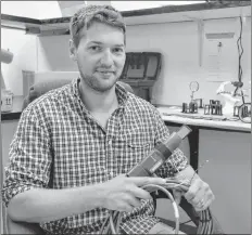  ?? TERRENCE MCEACHERN/THE GUARDIAN ?? Colin Ragush of Island Water Technologi­es in Charlottet­own, holds one of the bio-electrode sensors the company is installing in wastewater facilities across Canada.