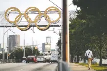  ??  ?? Olympic rings from the 1996 Summer Olympic Games in Atlanta stand against the downtown skyline in Atlanta.