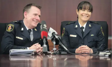  ?? DAX MELMER ?? Brad Hill, left, and Pam Mizuno — newly appointed deputy chiefs with the Windsor Police Service — are introduced by Mayor Drew Dilkens Tuesday during a news conference at Windsor police headquarte­rs.