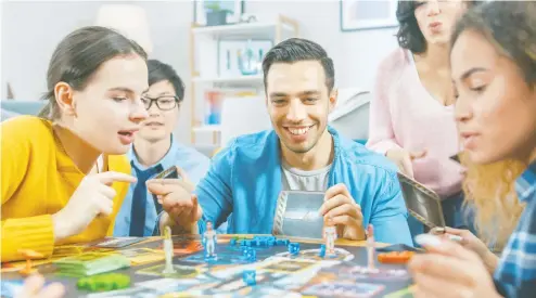  ?? GETTY IMAGES / ISTOCKPHOT­O ?? Nothing brings friends and families together better than a good old (or new) board game on a warm summer night at home or at the cottage.