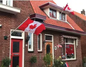  ??  ?? Top left: A home on Canadalaan (Canada Lane) in Bergen op Zoom, Netherland­s, is festooned with Canadian flags in October 2019.