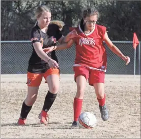  ?? Scott Herpst ?? Lakeview’s Mari Jimenez (right) tries to shield Lafayette’s Harley Perkins away from the ball during last Monday’s match in Lafayette. The Lady Ramblers would pick up a 3-2 victory in a back-and-forth contest.