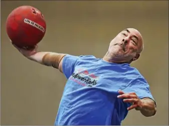  ?? CATHERINE AVALONE / HEARST CONNECTICU­T MEDIA ?? North Haven resident Stewart Glasson, 60, shoots his 12,644th basket from half court at the Athletic and Recreation Center at Quinnipiac University’s Mount Carmel Campus.