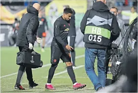  ??  ?? Concern: United’s Jesse Lingard departs after pulling up with a hamstring problem