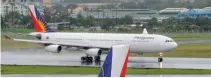  ??  ?? A PHILIPPINE AIRLINES plane taxis on the tarmac at Manila’s internatio­nal airport on Sept. 9, 2014.