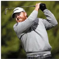  ?? AP/ RYAN KANG ?? J. B. Holmes hits his tee shot on the fourth hole during the fi nal round of the Genesis Open on Sunday at the Riviera Country Club in Los Angeles. Holmes rallied from a four- shot defi cit in the fi nal round for his fi rst victory in three years.