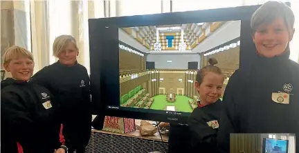 ??  ?? Waikanae School pupils present their re-creation of the Beehive’s debating chamber at Parliament.