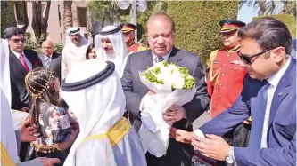  ??  ?? Pakistani Prime Minister Muhammad Nawaz Sharif receives flowers upon his arrival.