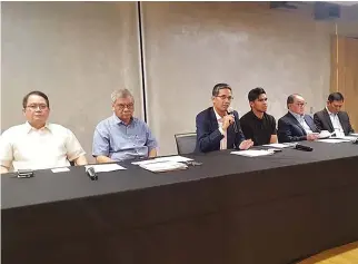  ??  ?? SBP OFFICIALS, led by President Al Panlilio (center), address members of media regarding the ban imposed on Gilas Pilipinas player Kiefer Ravena for failing a doping test in a press conference on Monday night.