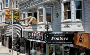  ??  ?? The well-photograph­ed legs that stick out of the window above the Piedmont Boutique.