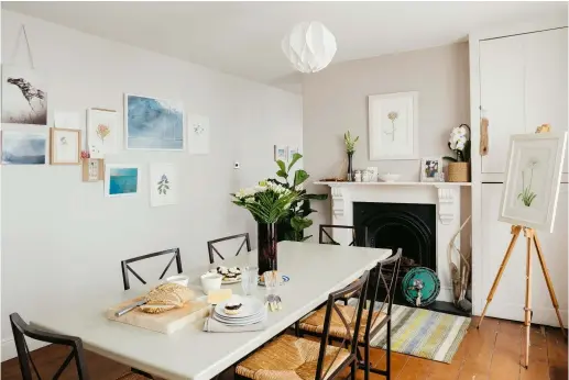  ??  ?? Above: In the dining room, Sarah Jane’s paintings create a focal point next to a repainted Habitat table and Ikea chairs. The pendant light is another Habitat buy