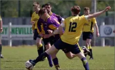  ??  ?? Ryan Furlong of Wexford Albion is challenged by Liam Flood of Rosslare Rangers ‘B’.