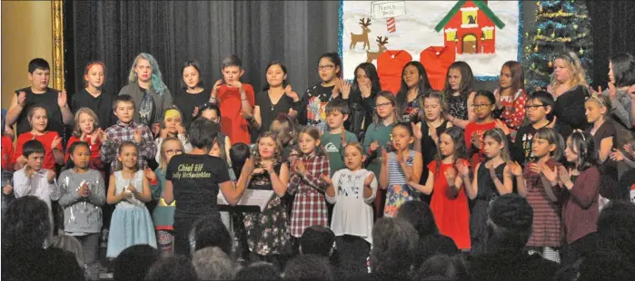  ??  ?? The Central School choir performed three songs at the start of the Dec. 20 concert. They are directed by music teacher Celia Hammerton.