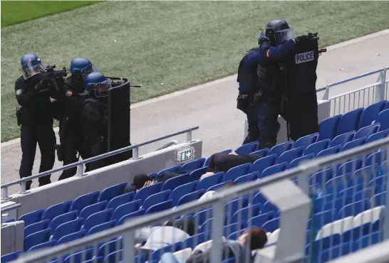  ?? (Emmanuel Foudrot/Reuters) ?? FRENCH POLICE take part in an anti-terrorism drill inside Groupama Stadium near Lyon, France, last year.