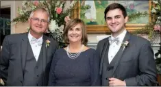  ??  ?? Parents of the bridegroom Gerald and Alisa Parker of Fayettevil­le and their son Garrett Parker of Kansas City, Mo.