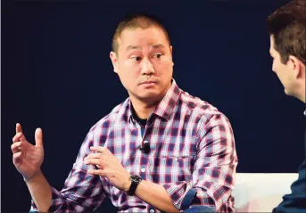  ?? Frederic J. Brown /AFP / Getty Images / TNS ?? 1 Above, Tony Hsieh, CEO of Zappos, during an October 2015 interview in Laguna Beach, Calif.