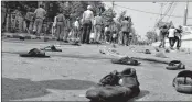  ??  ?? Footwears of Left Front activists lying on the road after their clash with the police at Howrah, Kolkata on Monday.