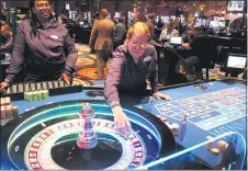  ?? WAYNE PARRY — THE ASSOCIATED PRESS ?? Dealers carry out a game of roulette at the Ocean Casino Resort in Atlantic City N.J. on June 18, 2019.