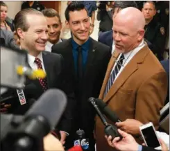  ?? AP PHOTO BY BOB LEVEY ?? David Daleiden, center, one of the two anti-abortion activists indicted last week, addresses the media with attorneys Jared Woodfill, left, and Terry Yates after turning himself in to authoritie­s on Thursday in Houston.