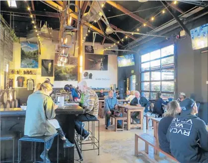  ?? Photograph­s by Irene Lechowitzk­y ?? A 1904 feed mill in Santa Barbara has been converted into the Mill, where businesses include Third Window Brewing Co.