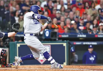  ?? AFP ?? JOC PEDERSON of the Los Angeles Dodgers hits a three-run home run during the ninth inning against the Houston Astros in game four of the 2017 World Series at Minute Maid Park on Oct. 28 in Houston, Texas.