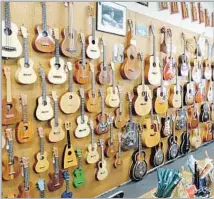  ?? Folk Music Center Museum & Store ?? AN ARRAY of string instrument­s is among the antique and modern offerings at the Folk Music Center Museum & Store.