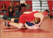  ?? ROD JAMES - FOR DIGITAL FIRST MEDIA ?? Hamburg’s Ben Weidenhamm­er uses a headlock to pin Elco’s Bobby Walck in the first period of a 195-pound semifinal at the District 3-AA Section 1 tournament at Hamburg.