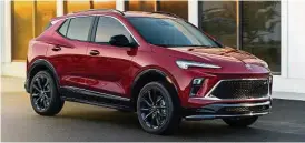  ?? ?? The 2024 Buick Encore GX Sport Touring model is shown here in Cinnabar Metallic.